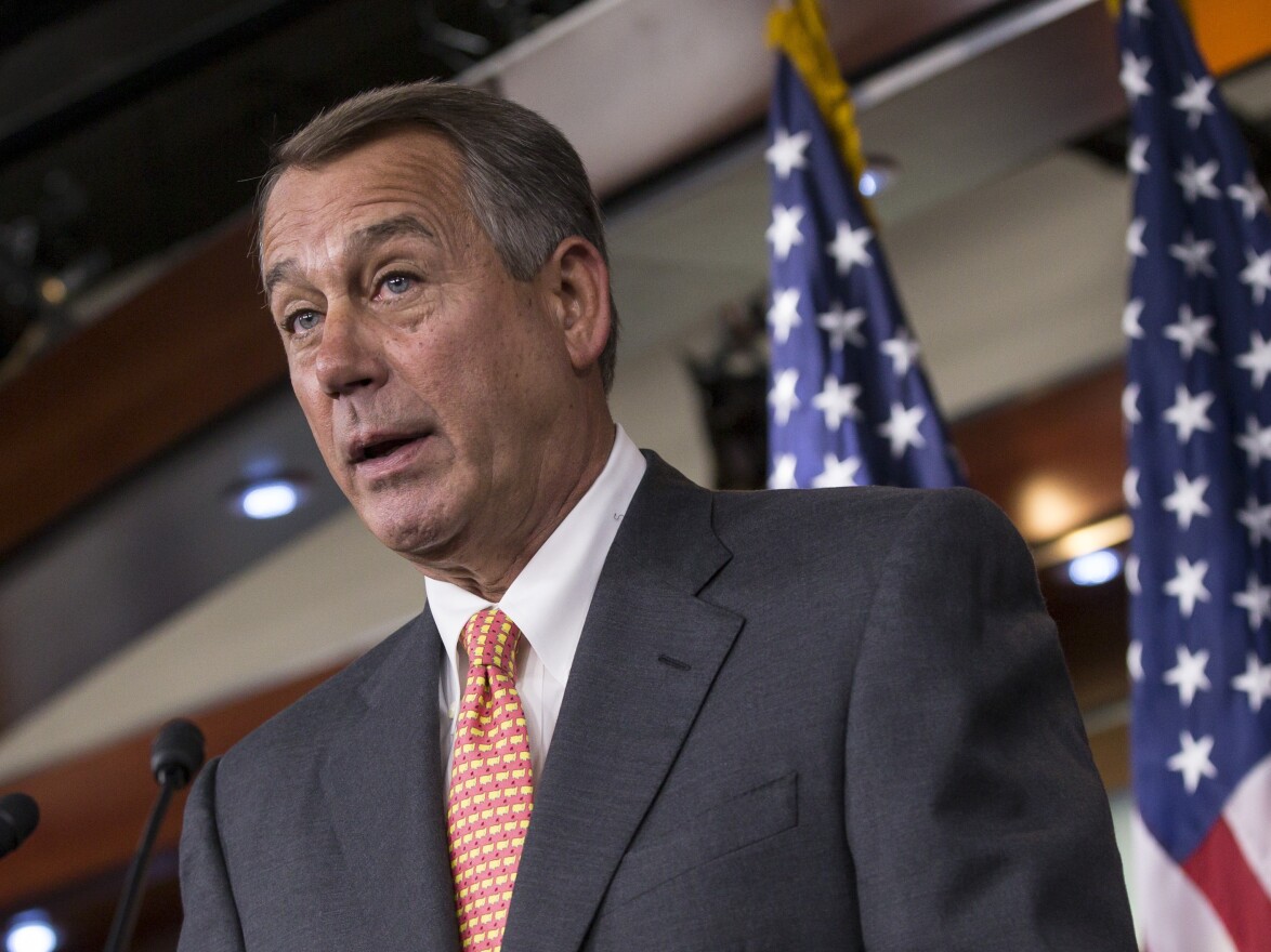 Speaker of the House John Boehner (R-Ohio) talks to reporters Thursday about the deadline to fund the government while simultaneously eliminating President Obama's health care law.